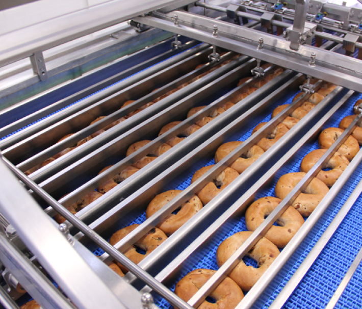 Bagels entering the collating and bagging system